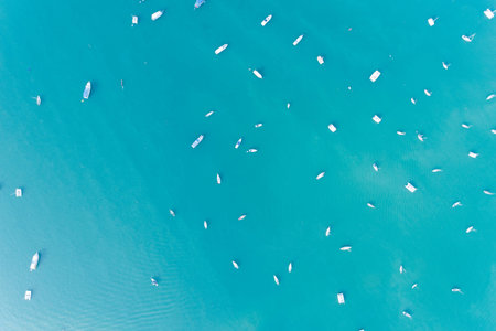 Top view aerial drone shot of sailing boats in tropical sea