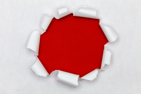 Ripped open paper background,space for your message on torn paper.の写真素材