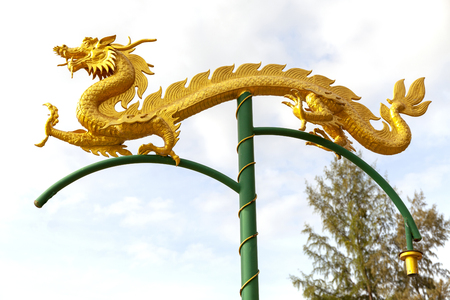 Chinese Dragon statue on pole sky background.の写真素材