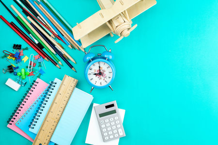 Back to school background with School supplies on green paper background ready for your design and copy space for your text.の写真素材