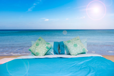 Bed with pillow in the nature happy summer holiday at the tropical sea.