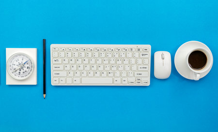 Top view of Office desk table of Business workplace and business objects on blue background.