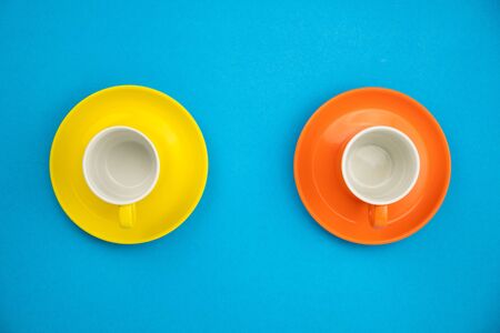Colorful coffee cup on blue paper background.の写真素材
