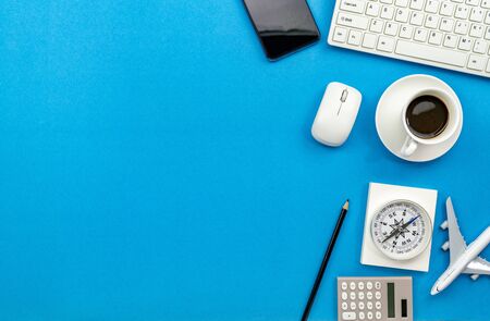 Top view of Office desk table of Business workplace and business objects on blue background copy space for your text.の写真素材
