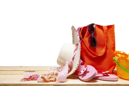 Summer background of beach hat and accessories for holiday time on white background copy space for your text in summer and travel backgroundの写真素材