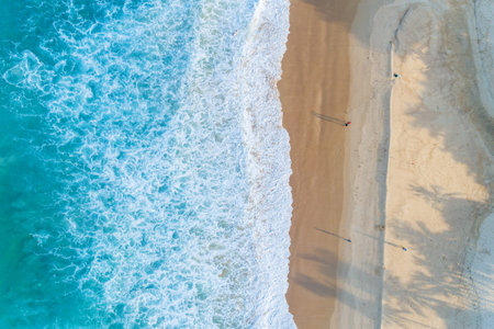 Aerial view sandy beach and waves Beautiful tropical sea in the morning summer season image by...
