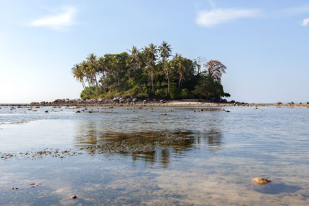 Small island with blue ocean and blue sky background image for nature background or summer design...