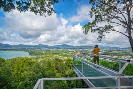 Terrace with a beautiful landscape scenery view of Tropical sea and mountain blue sky white clouds in Phuket Thailandの写真素材