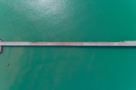 Aerial top view drone shot of small bridge in the sea image transportation background concept and...