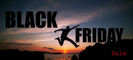 Black friday sale text on Beautiful sunset or sunrise sky with silhouette man on mountain peak concept business marketing background and product sale design copy space for text.の写真素材