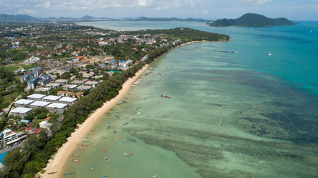 Aerial View of Thai traditional longtail fishing boats in the tropical sea beautiful beach in phuket...