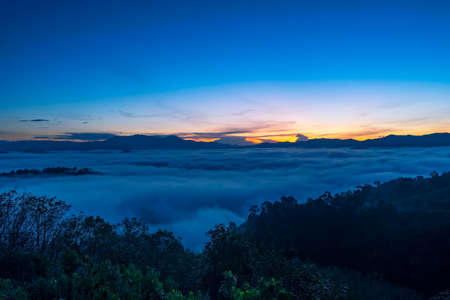 Amazing scenery Nature landscape nature view Aerial view drone camera photography of Mist or fog flowing on Mountain peak in the morning sunrise or sunset At Khao Khai Nui Phang Nga Thailand.の写真素材