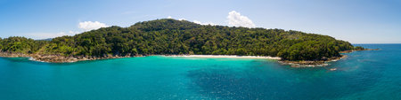 Aerial view drone shot Amazing panorama Freedom beach at phuket island beautiful island in thailand Amazing High angle view Island seashore with blue sky cloudy sky background Travel holiday Concept.の写真素材