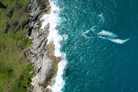 Aerial view Top down seashore wave crashing on seashore Beautiful turquoise sea surface in sunny day Good weather day summer background Amazing seascape top view.の写真素材