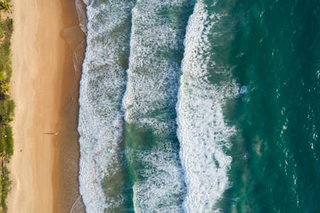 Top View of the Sea texture waves Foaming and Splashing in the Ocean Sunny day beautiful sea surface background.の写真素材