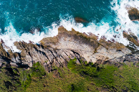 Aerial view Top down seashore wave crashing on seashore Beautiful turquoise sea surface in sunny day Good weather day summer background Amazing seascape top view.の写真素材