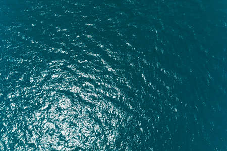 Sea surface aerial view,Bird eye view photo of blue waves and water surface texture Blue sea background Beautiful nature Amazing nature sea.の写真素材