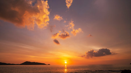 Amazing seascape with sunset clouds over the sea with dramatic sky sunset or sunrise Beautiful nature minimalist background and texture Panoramic nature view landscape Dramatic light sky and clouds.の写真素材