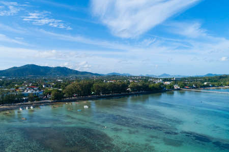 Aerial view drone shot of tropical sea at rawai beach Phuket Thailand Beautiful scenery andaman sea and small island in summer season Beautiful travel background and website design nature view.の写真素材