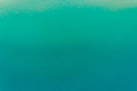 Sea surface aerial view Bird eye view photo of small waves and water surface texture Turquoise sea background Beautiful nature Amazing view nature background.の写真素材