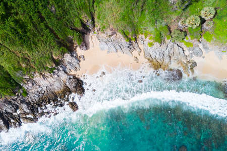 Amazing Sea aerial view Top down seashore nature background Beautiful Tropical beach with rocky mountains and turquoise clear water of Phuket Thailand ocean at sunny summer day Landscape background.の写真素材