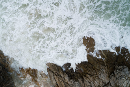 Aerial view of Amazing seashore at Phuket Thailand beautiful wave crashing on seacoast Top view sea...
