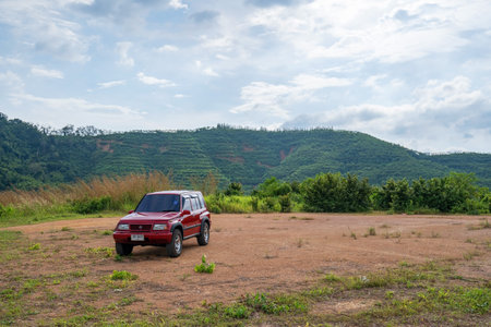 3 October 2021 Red 4x4 car Suzuki Vitara 1993 on the High mountain view Beautiful sea view at...