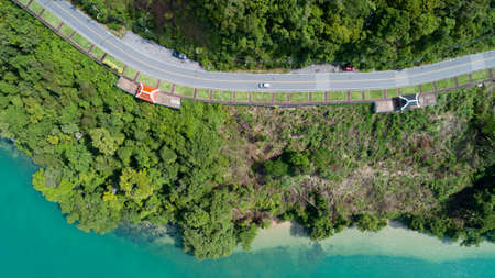 Aerial view top down of road curve around Phuket island at khao khad viewpoint Beautiful sea and mountain forest treesの写真素材
