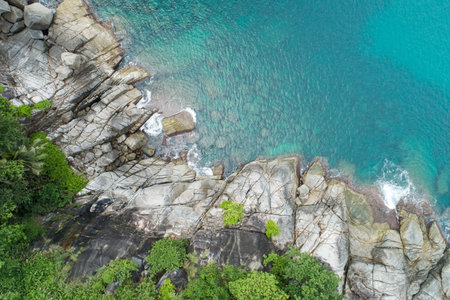 Aerial view Top down seashore wave crashing on seashore Beautiful turquoise sea surface in sunny day...