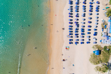 Aerial view Amazing sandy beach and small waves Beautiful tropical sea in the morning summer season...