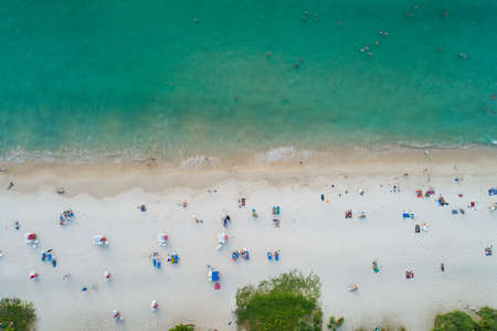 Aerial view top down of Coconut palm trees on the beautiful patong beach Phuket Thailand Amazing sea beach sand tourist travel destination in the andaman sea Beautiful island on February 12-2022の写真素材