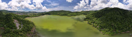 Panorama landscape nature lake or pond Aerial view drone shot of scenery mountain green tropical rainforest and blue sky in phuket thailandの写真素材