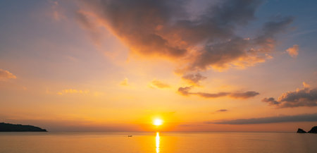 Landscape Long exposure of majestic clouds in the sky sunset or sunrise over sea with reflection in...
