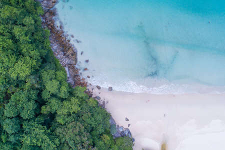 Aerial view Top down seashore wave crashing on seashore Beautiful turquoise sea surface in sunny day Good weather day summer background Amazing beach top viewの写真素材