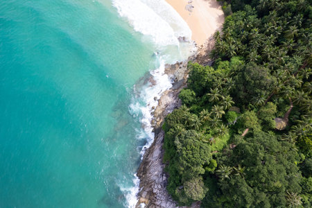 Aerial view Top down seashore wave crashing on seashore Beautiful turquoise sea surface in sunny day...