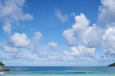 White clouds in blue sky over blue sea water landscape summer greeting backgroundの写真素材