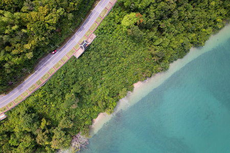 Aerial view of curve road along the seashore at Phuket Thailand beautiful seacoast and open sea in...