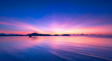 Landscape Long exposure of majestic clouds in the sky sunset or sunrise over sea with reflection in the tropical sea.Beautiful cloudscape scenery.Amazing light of nature Landscape nature backgroundの写真素材