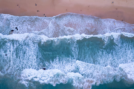 Aerial view sandy beach and big waves crashing on sandy shore, Beautiful tropical sea in the morning...
