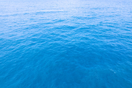 Sea surface aerial view,Bird eye view photo of blue waves and water surface texture Blue sea background Beautiful nature Amazing seascapeの写真素材