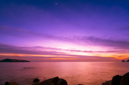 Landscape Long exposure of majestic clouds in the sky sunset or sunrise over sea with reflection in the tropical sea.Beautiful cloudscape scenery.Amazing light of nature Landscape nature backgroundの写真素材
