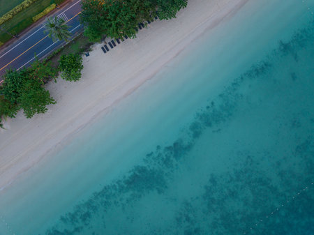 Top view sea beach waves crashing on sandy shore Nature backgroundの写真素材