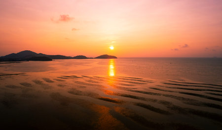 Aerial view sunset sky, Nature beautiful Light Sunset or sunrise over dark sea, Colorful dramatic majestic scenery Sky with Amazing clouds and waves in sunset sky nature light cloud backgroundの写真素材