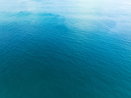 Sea surface aerial view,Bird eye view photo of blue waves and water surface texture Blue sea background Beautiful nature Amazing view sea backgroundの写真素材