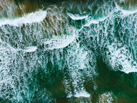 Sea surface aerial view,Bird eye view photo of crashing waves and water surface texture,Green sea background, Beautiful nature seascape,Amazing view sea backgroundの写真素材
