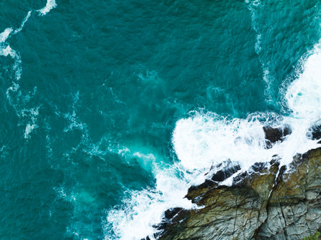 Seashore aerial view,Bird eye view photo of crashing waves on rocks beautiful water surface texture,Dark sea background,Beautiful nature seascape,Amazing view sea backgroundの写真素材