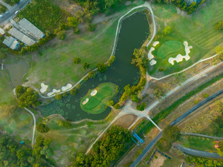 Aerial view drone shot of beautiful green golf field fairway and putting green Top down image for sport background and travel nature background Amazing viewの写真素材