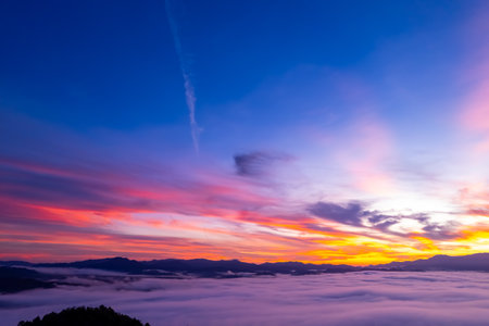 Amazing Sunrise or sunset over mountains hills covered with mist, Aerial view landscape drone shot beautiful colorful nature backgroundの写真素材