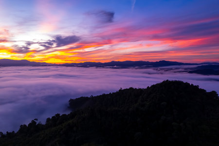 Amazing Sunrise or sunset over mountains hills covered with mist, Aerial view landscape drone shot beautiful colorful nature backgroundの写真素材