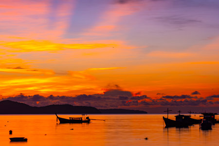 Beautiful colorful sunset or sunrise sky over sea with dramatic clouds nature environment backgroundの写真素材